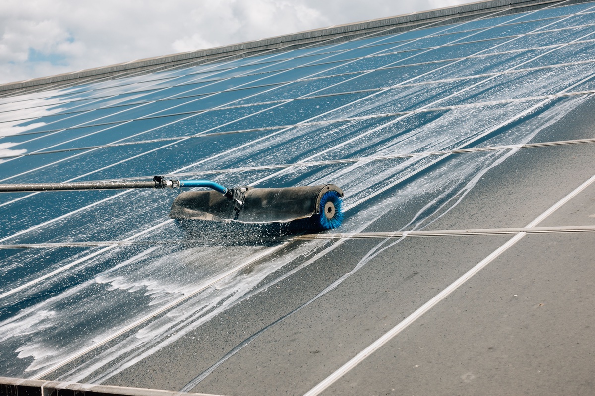 Close-up shot of solar system panel cleaning process why cleaning solar panels with deionized water is best